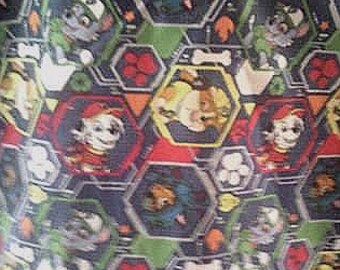 May include: A patterned shirt featuring a repeating design of cartoon characters within hexagonal shapes. The design incorporates various colors, including red, blue, green, and yellow. The shirt's pattern includes images of paw prints and bones.