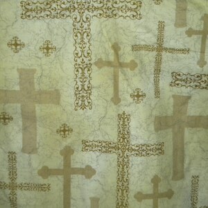 May include: A fabric with a repeating pattern of crosses in varying sizes and styles. The crosses are a light brown color and are set against a pale green background with a marbled texture. Some crosses have ornate, decorative borders.