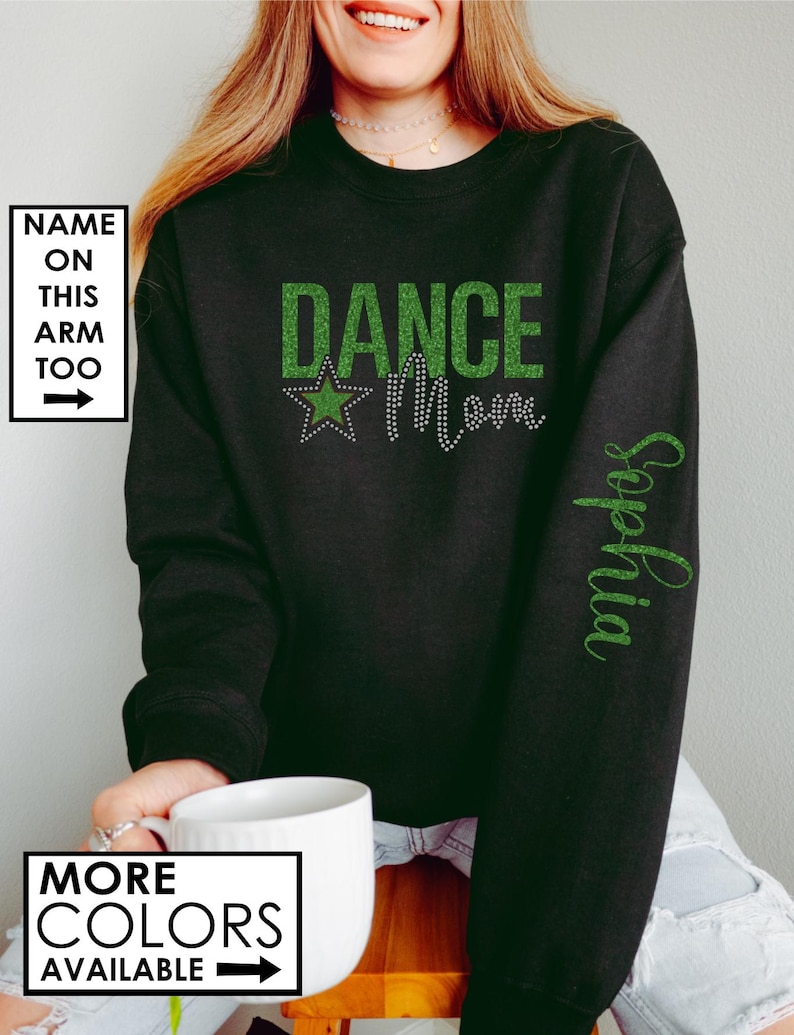 May include: Black sweatshirt with green glitter text that reads "Dance Mom" with a green star. The text "Sophia" is written in green glitter on the right sleeve.