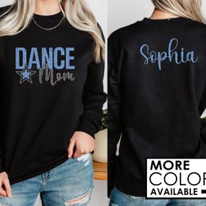 May include: Black sweatshirt with blue glitter text that says "Dance Mom" and a blue glitter star on the front. The back of the sweatshirt has blue glitter text that says "Sophia".