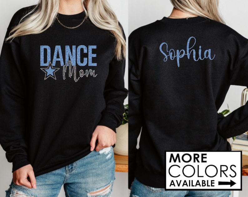 May include: Black sweatshirt with blue glitter text that says "Dance Mom" and a blue glitter star on the front. The back of the sweatshirt has blue glitter text that says "Sophia".