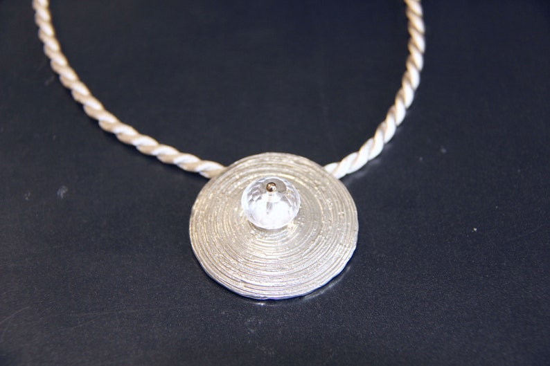 rock crystal pendant with spiral pattern of 925silver and 750gold
