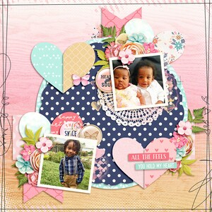 May include: A scrapbook page with a blue and white polka dot background. There are three photos of children, a heart-shaped paper cutout, and a floral embellishment. The text "happy heart this makes me smile" and "all the feels you hold my heart" are included.