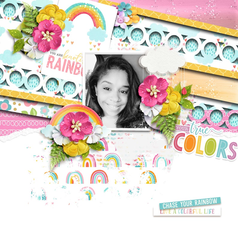 May include: A scrapbook page featuring a black and white photograph of a person, a rainbow, and the text "You are a beauty RAINBOW" and "YOUR true COLORS". The page is decorated with flowers, glitter, and a rainbow pattern.