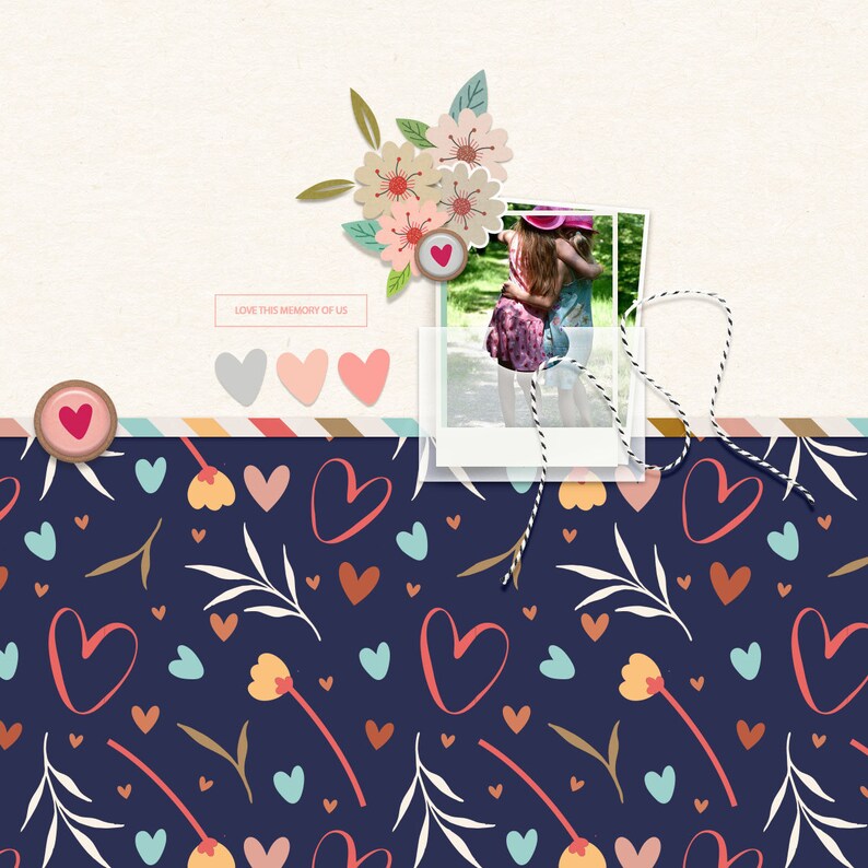 May include: A scrapbook page with a photo of two girls hugging in a park. The photo is surrounded by a floral design and hearts. The text "LOVE THIS MEMORY OF US" is printed on a white rectangle at the top of the page.