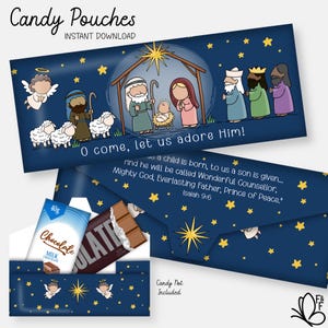 May include: Candy pouches with a navy blue background and a Christmas nativity scene illustration. The pouches feature angels, stars, and text that reads "O come, let us adore Him!" and "Candy Not Included". The pouches are designed to hold candy.
