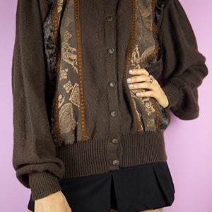 The Vintage 90s Brown Puff Sleeve Cardigan is a dark brown mohair blend cardigan with embroidered and faux fur details and puff sleeves. Boho fairy grunge 1990s knitted sweater.