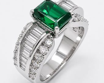 Green tourmaline about 1.75 cts. set in Platinum ring with baguettes along the shank.