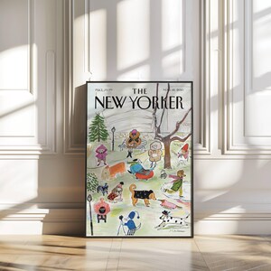 May include: A framed print of a New Yorker magazine cover featuring a park scene with dogs and people. The illustration is in a whimsical style, with figures in winter clothing and various dog breeds. The magazine title is prominently displayed.