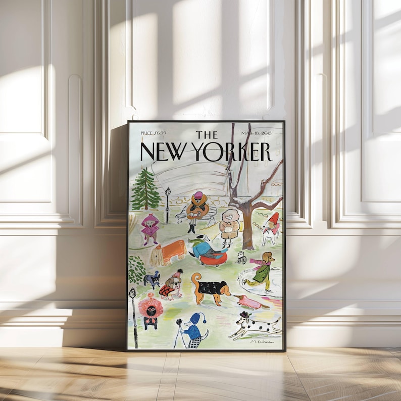May include: A framed print of a New Yorker magazine cover featuring a park scene with dogs and people. The illustration is in a whimsical style, with figures in winter clothing and various dog breeds. The magazine title is prominently displayed.