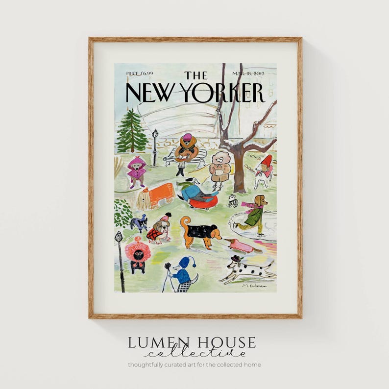 May include: A framed print of a New Yorker magazine cover featuring a whimsical illustration of dogs in a park setting. The artwork includes the magazine title, date, and price. The print is in a wooden frame.