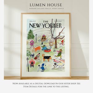 May include: A framed print of a New Yorker magazine cover featuring a park scene with dogs and people in winter attire. The print has a light wood frame and includes the magazine title and date.