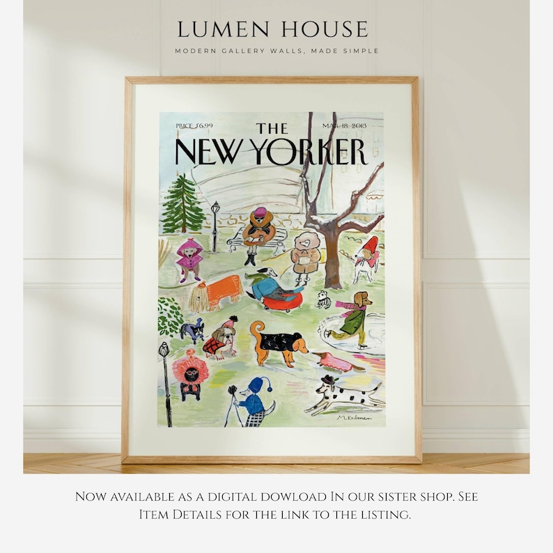 May include: A framed print of a New Yorker magazine cover featuring a park scene with dogs and people in winter attire. The print has a light wood frame and includes the magazine title and date.