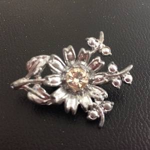 Silver Alloy and Crystal Floral Brooch
