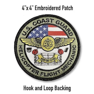 May include: A circular embroidered patch, 4" x 4", with the text "U.S. COAST GUARD HELICOPTER FLIGHT MECHANIC." The patch features a design with wings, the American flag, and the words "KEEP 'EM FLYING." It has hook and loop backing.