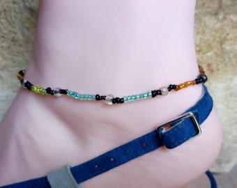 Perfect gift, Sturdy stretch anklet with black, green, orange, blue and transparent white seed beads, without clasp