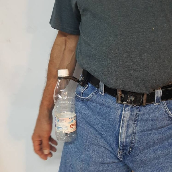 Bottle Carrier With belt Loop, Can Also Be Clip On To Your Backpack Or Fanny pack.