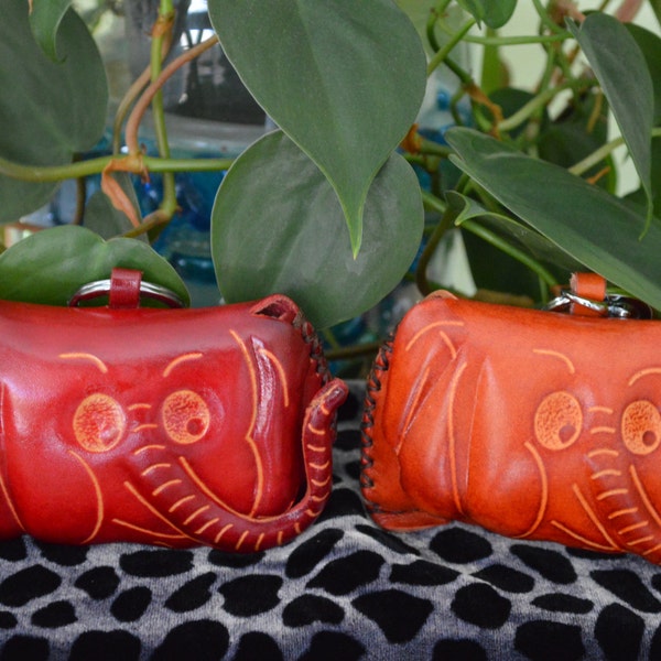 Genuine leather Change/coin purse,a Red Elephant face cover pattern, a small wristlet but it's cute.