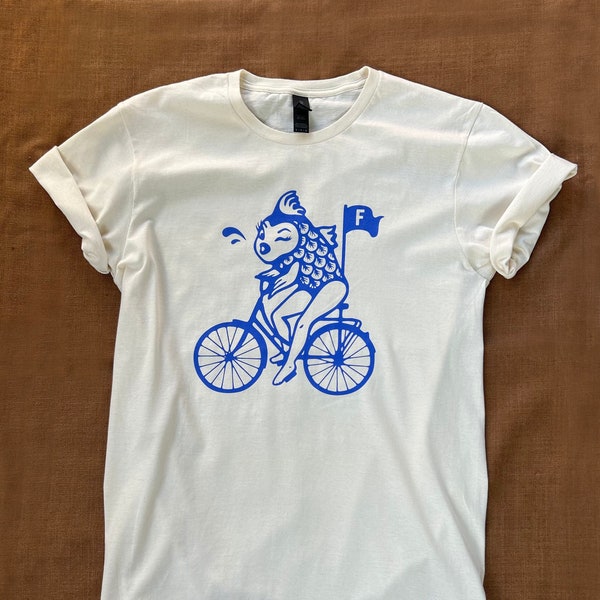 Feminist / Feminism T-Shirt Depicting Quote "A woman needs a man like a fish needs a bicycle."