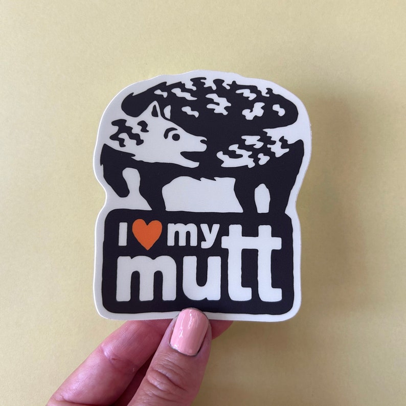 May include: White sticker with a black silhouette of a dog with a heart and the text "I love my mutt".