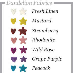 Op de afbeelding: Een kaart met acht verschillende kleuren viltstofstalen, elk met een hart- en een stervorm. De kleuren zijn: Vers Linnen (wit), Mosterd (geel), Aardbei (rood), Rhodonite (roze), Wilde Roos (paars), Druivenpaars (donkerpaars), Pauw (blauw), Zilverwilg (groen) en Antraciet (zwart).