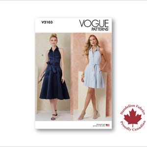 May include: Vogue Patterns sewing pattern showing two halter-neck dresses. One is navy blue with a waist bow, the other light blue with a belt. The pattern includes the text "V2103" and "Vogue Patterns."