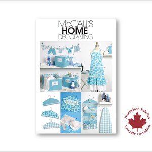 May include: A collage of home decorating items, including an apron, storage boxes, hangers, and a hanging organizer. The items feature a blue and white floral or gingham pattern. The text "McCall's Home Decorating" is at the top.
