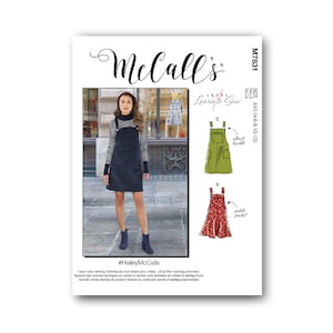 Peut inclure: Patron de couture McCall's M7831 pour une robe de niveau Apprendre à Coudre avec un chemisier à rayures noires et blanches, une robe salopette noire et deux styles différents de robes salopettes. Le patron comprend des instructions pour ajouter des poches et une boucle attachée.