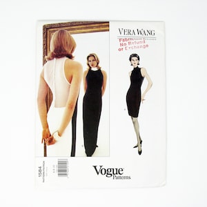 May include: A sewing pattern for a black sleeveless dress with a high neck. The pattern is by Vera Wang and is for Vogue Patterns. The text on the pattern says "Fabric: No Refund or Exchange".