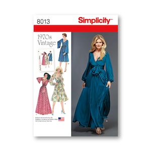 May include: Simplicity sewing pattern 8013 for a 1970s vintage dress with long sleeves and a wrap style. The pattern includes three different dress styles, one in blue, one in pink and white floral, and one in a teal blue.