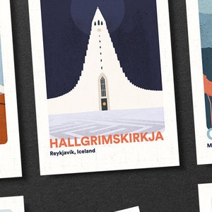 May include: A set of four illustrated postcards featuring iconic landmarks. The postcards are printed on white cardstock with a textured surface. The first postcard features a mountain range with snow-capped peaks. The second postcard features a tall, white church with a steeple. The third postcard features a bridge with red supports. The fourth postcard features a bridge with orange supports. The text on the postcards reads "Denali, Alaska", "Hallgrimskirkja, Reykjavik, Iceland", "Golden Gate Bridge, Marin County, San Francisco", and "Golden Gate Bridge, Marin County, San Francisco".