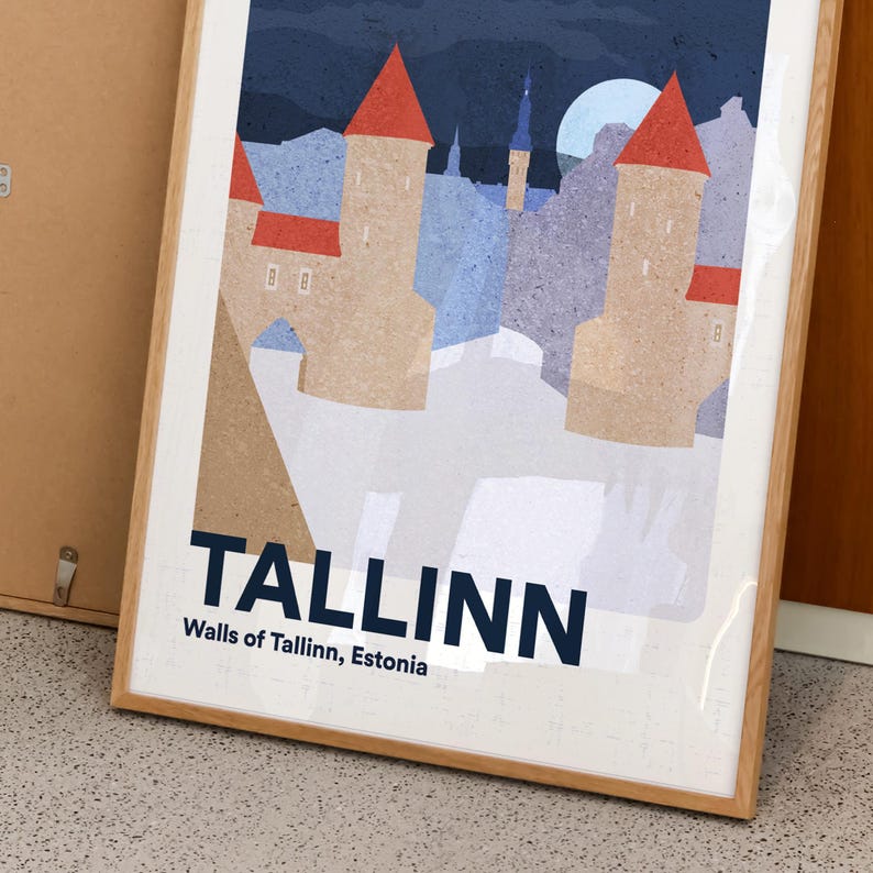 May include: Framed art print showing a stylized illustration of Tallinn, Estonia. The artwork depicts the city's walls and towers with red roofs, set against a night sky with a full moon. The word "TALLINN" is prominently displayed.