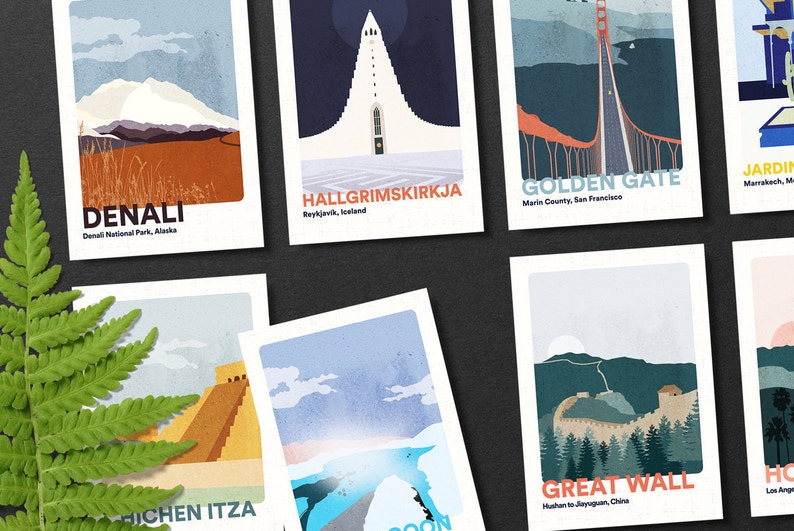 May include: A set of colorful illustrated postcards featuring various landmarks around the world. The postcards feature illustrations of Denali National Park, Hallgr&iacute;mskirkja church in Reykjavik, Iceland, the Golden Gate Bridge in San Francisco, Chichen Itza in Mexico, the Great Wall of China, and the Hollywood sign in Los Angeles.