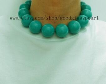 May include: A turquoise beaded necklace featuring large, spherical beads. The necklace measures approximately 40.6 cm in length. The Etsy shop URL www.etsy.com/shop/goodglasspearl is visible in the image.