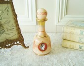 Vintage French glass perfume bottle with motifs of ancien Greek warriors