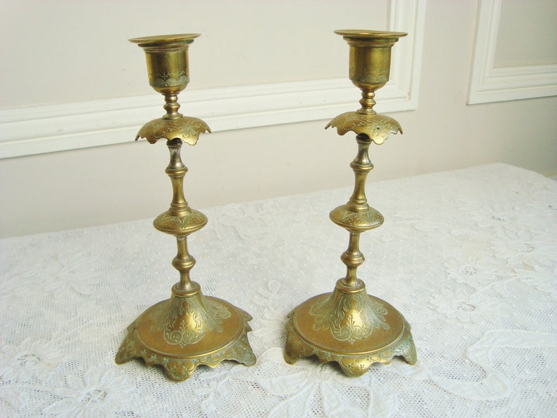 Pair ornate antique candlesticks with elegant engraved motifs 19th century candle holders