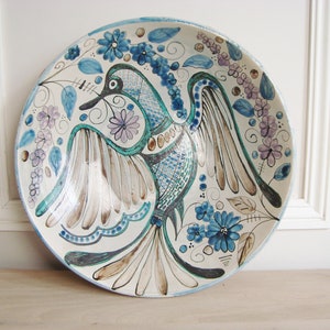 Large decorative ceramic bowl with bird and floral motifs signed Maja