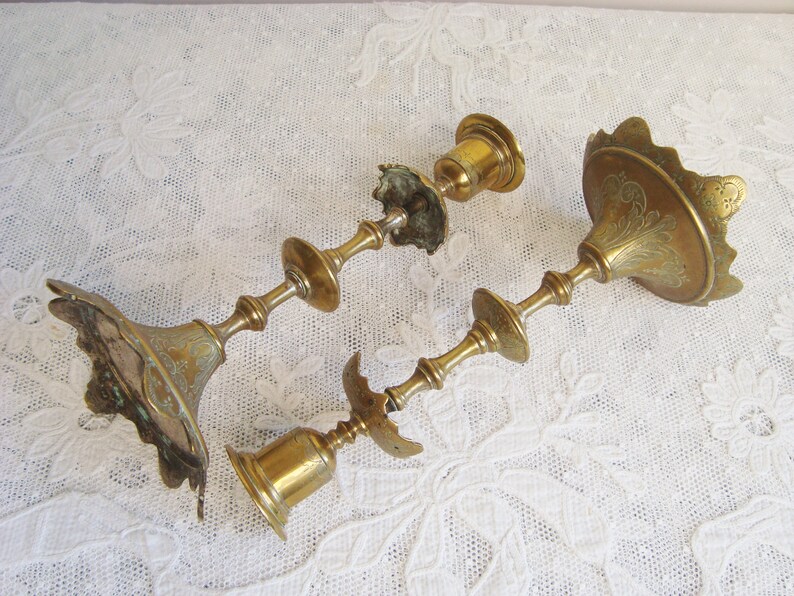 Pair ornate antique candlesticks with elegant engraved motifs 19th century candle holders