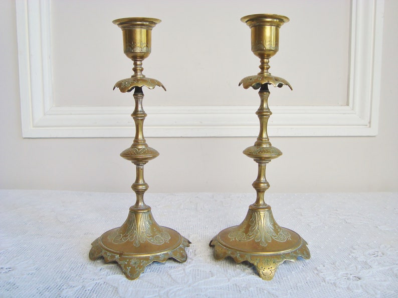 Pair ornate antique candlesticks with elegant engraved motifs 19th century candle holders