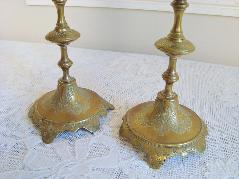 Pair ornate antique candlesticks with elegant engraved motifs 19th century candle holders