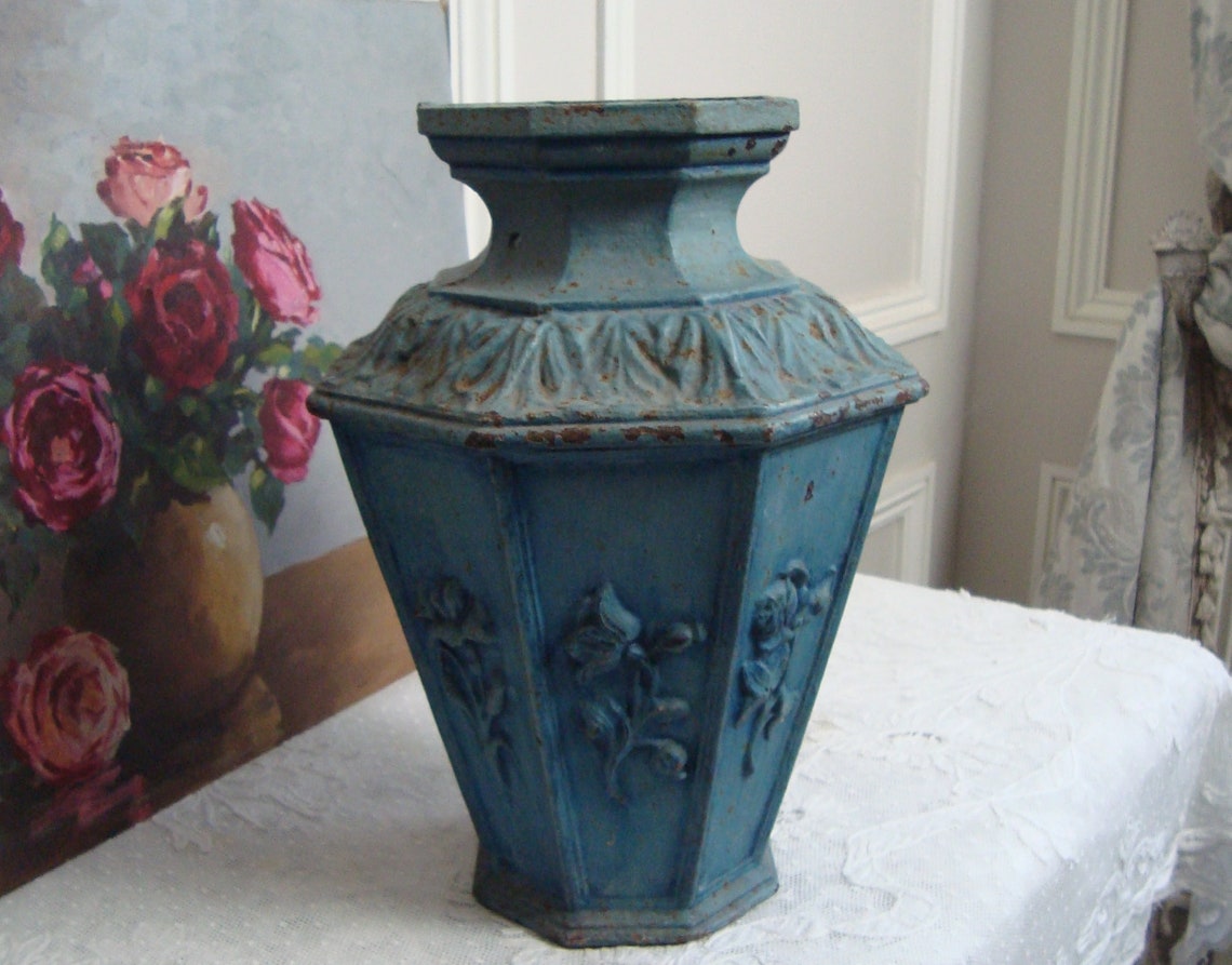 Antique French cast iron vase with floral motifs from a Etsy