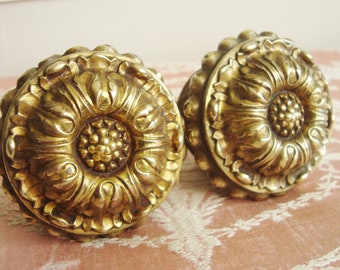 Pair antique sunflower finials in repousse brass Embossed metal curtain pole ends