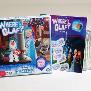 May include: A blue and white board game box with the text "Where's Olaf?" and a picture of Olaf the snowman from the Disney movie Frozen. The game is for ages 4 and up.