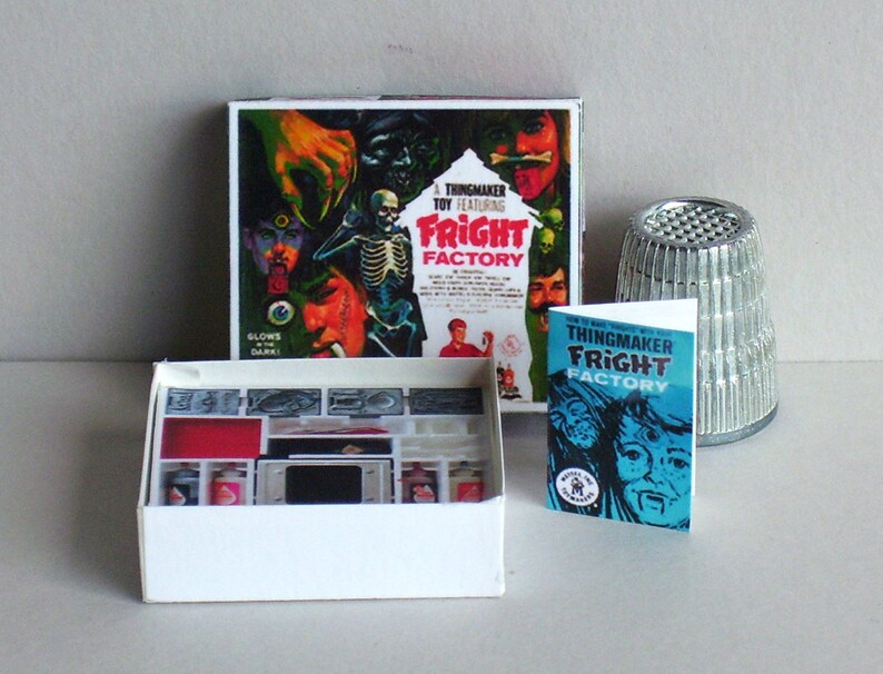 May include: A vintage "Thingmaker Fright Factory" toy set with a box featuring a monster and a skeleton, a white plastic tray with compartments, and a blue and white instruction booklet. The set includes a silver thimble-shaped container.