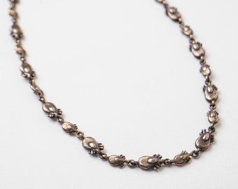 Parasitic Tick chain Necklace with two links in Silver and Bronze.