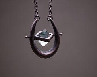 Spinning Fluorite Crystal in Thick Silver Frame