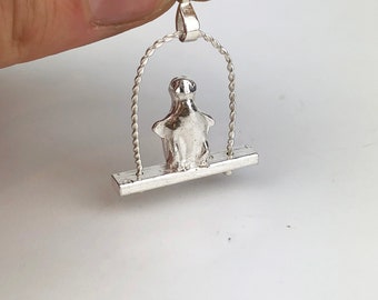 Silver penguin necklace, sterling silver. penguin on a swing,