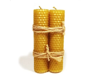 Beeswax candles rolled .