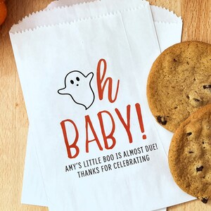 May include: White paper bag with a ghost and the text "Oh Baby!" in red. The text below reads "Amy's little boo is almost due! Thanks for celebrating."
