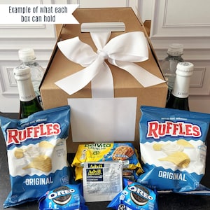 a box of chips, chips, and a bottle of wine